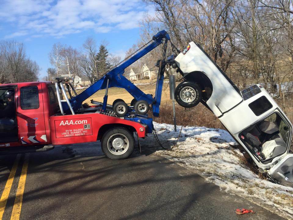 jims tow winching white truck side view